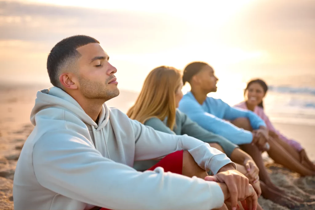 man with closed eyes relaxing with friends on vaca 2024 04 03 12 28 48 utc