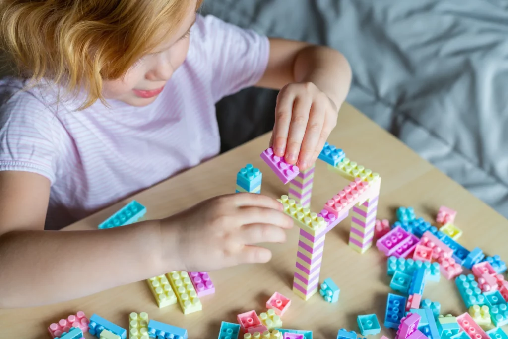 small preschooler girl playing with colorful toy b 2023 11 27 05 16 54 utc